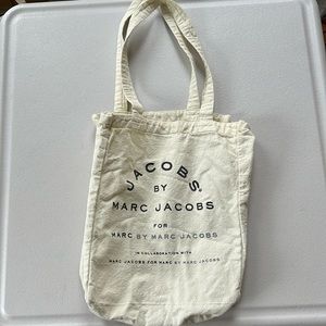 Marc Jacobs small tote. 11 x 9.5  wide x4-53/4” deep with a 9.5” handle drop. A1